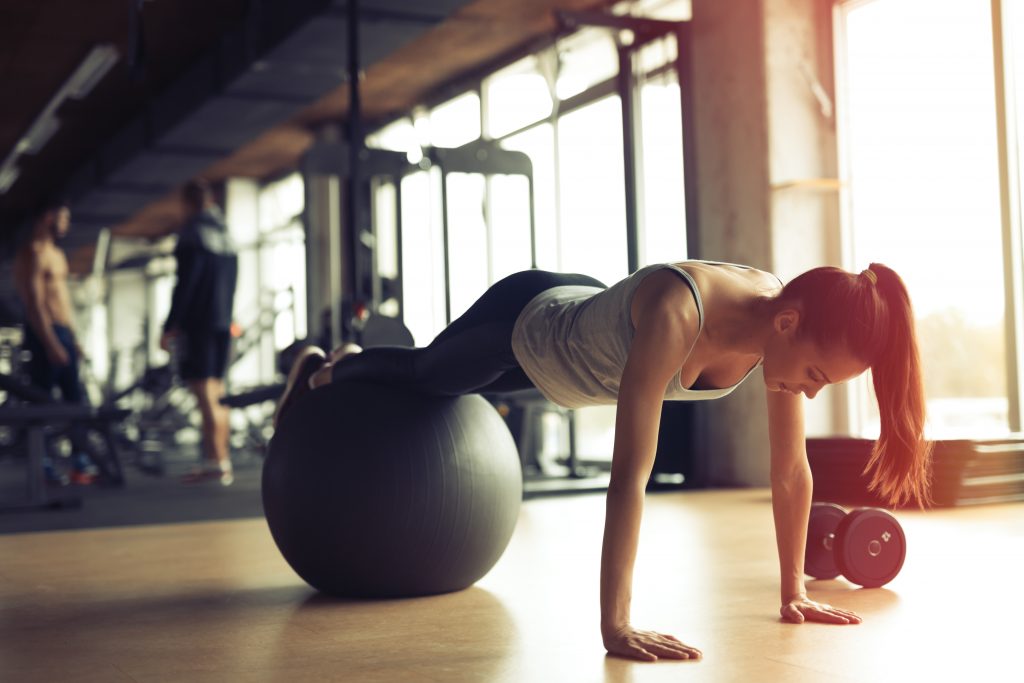 Woman doing plank on stability ball